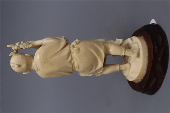 A Japanese ivory okimono group of a gentleman, a cockerel and a young boy, overall height 20cm